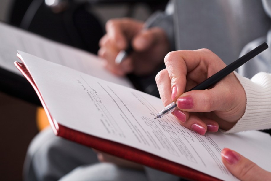 people writing on a paper