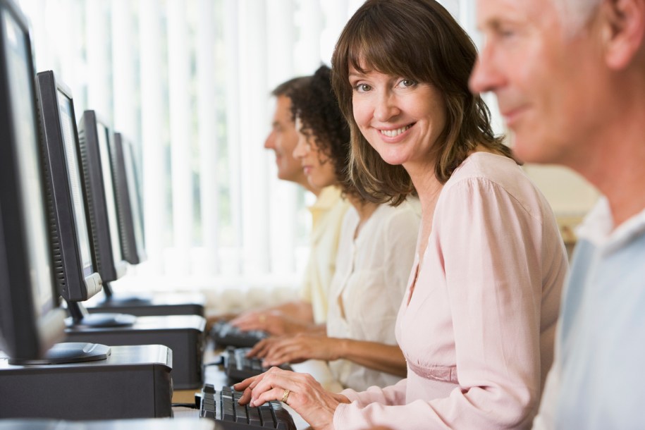 Adult students using computers