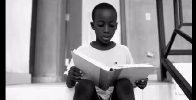 A kid reading a book