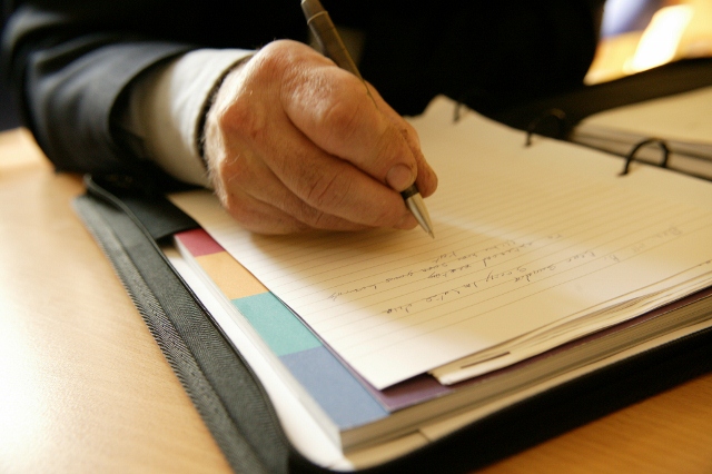 Man writing on a paper