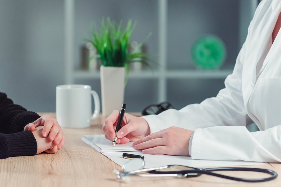 GP seated at the desk