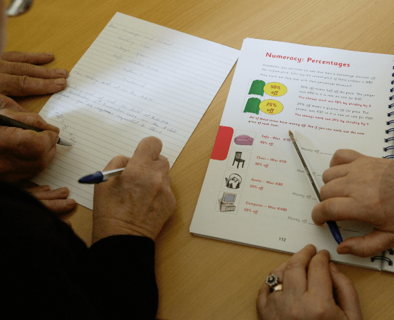 Some adult students study numeracy