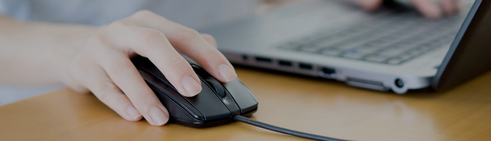 Closeup of woman hand clicking mouse outdoor