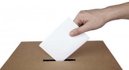 Stock image: a person hand is casting a vote