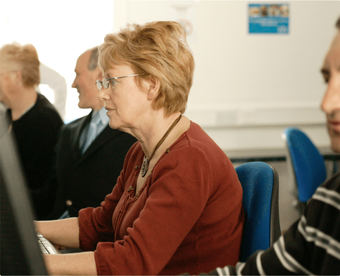 people sitting in front of a desktop PC