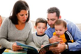 Stock image of family reading a book