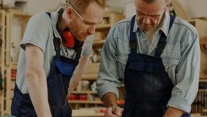 an experienced worker is training an apprentice