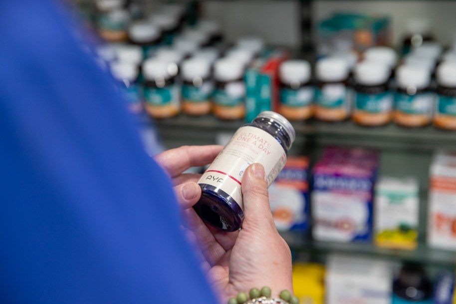 Person looking at medicine label