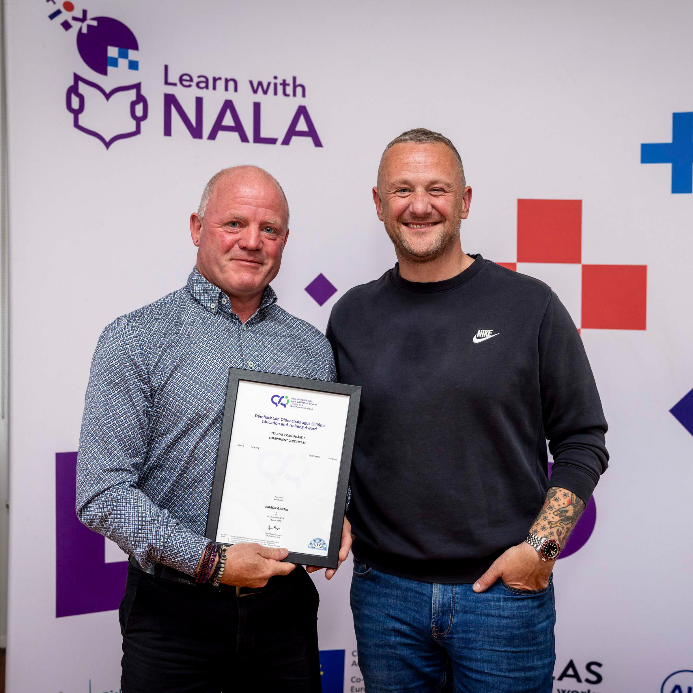 Learn with NALA learner Eamon receiving an award from PJ Gallagher